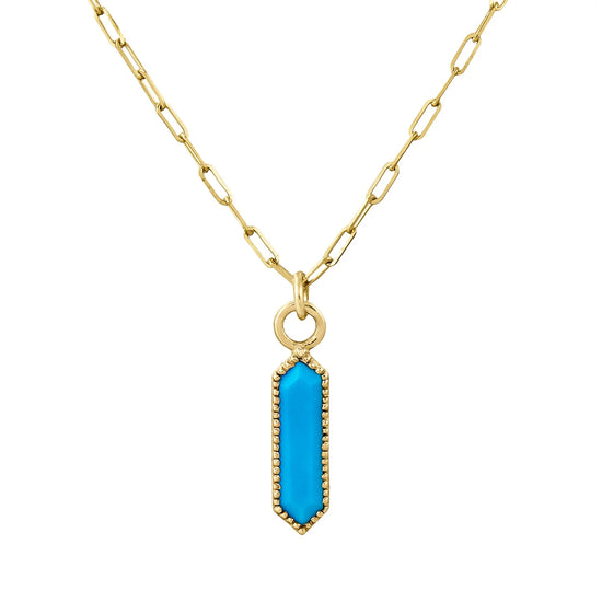 hexagon turquoise pendant with a gold milgrain bezel on a paperclip chain on a white background