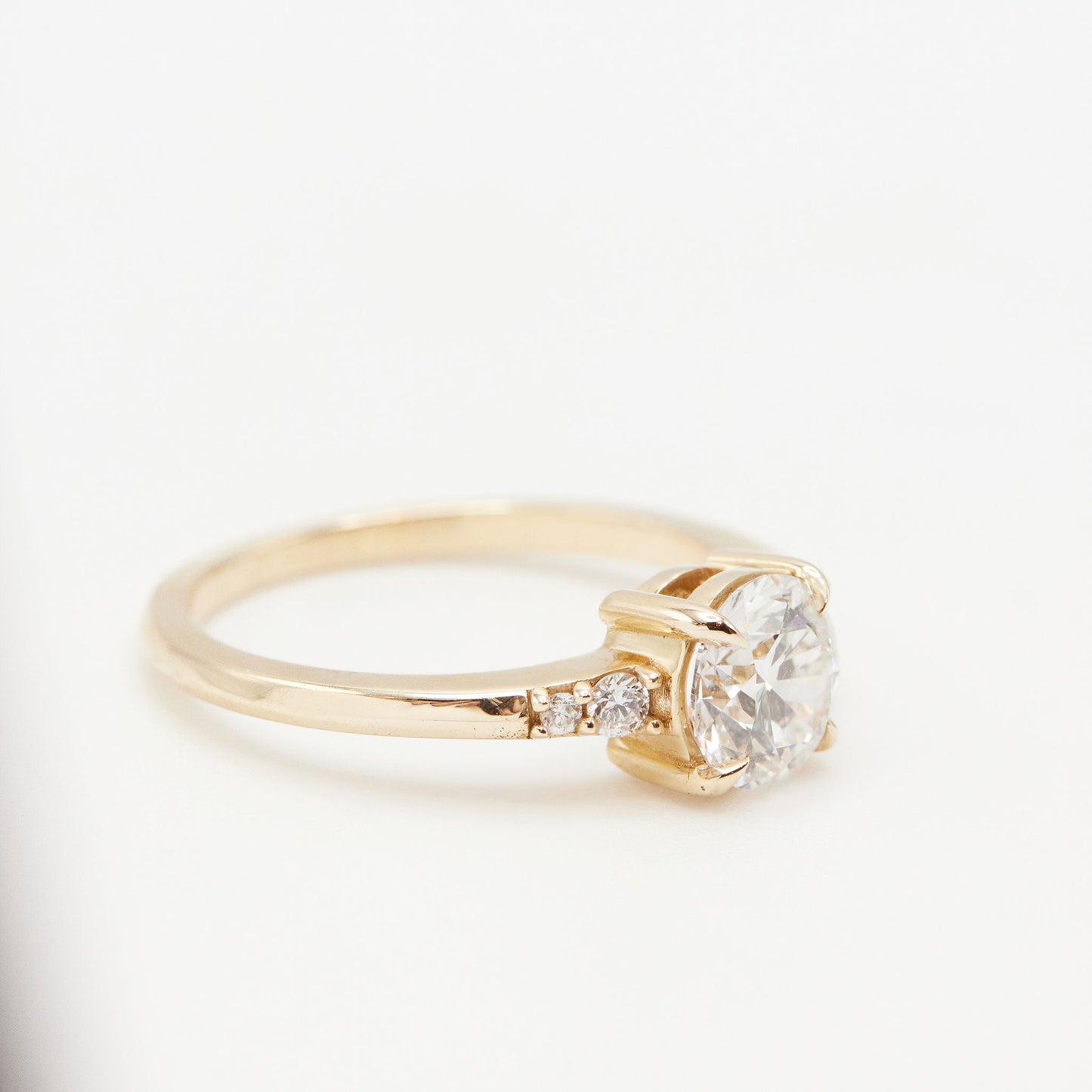 Side view of Five stone ring on white background
