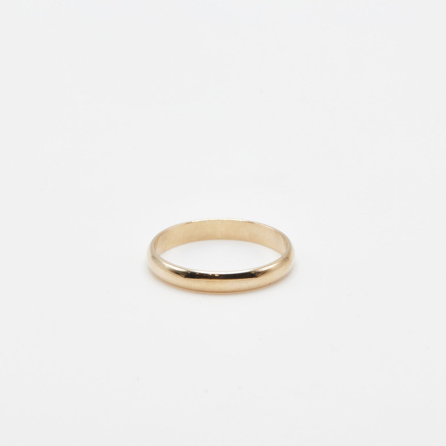 3 mm yellow gold half round wedding band on a white background