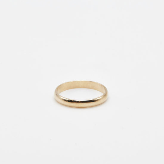 3 mm yellow gold half round wedding band on a white background