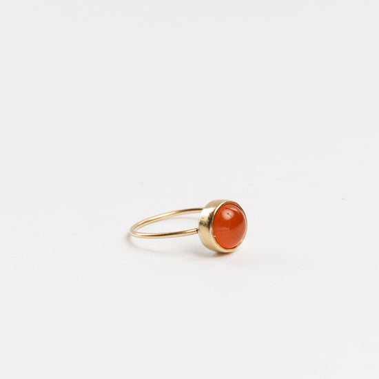 side view of the carnelian ring on a white background