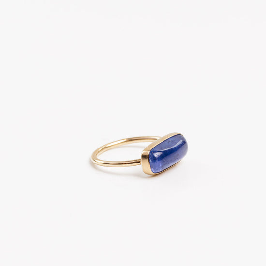 side view of the tanzanite ring on a white background
