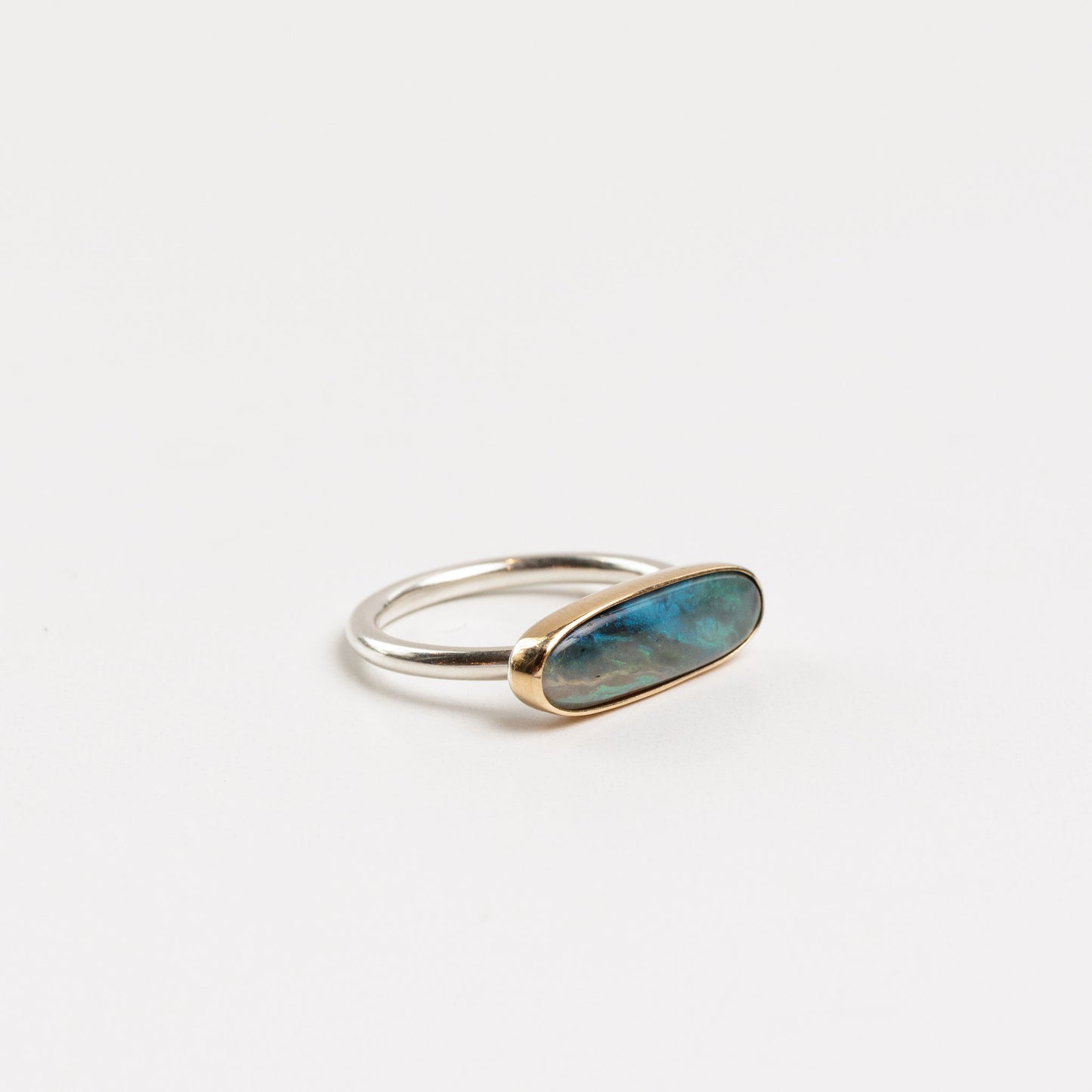 angled view of the blue opal bar ring