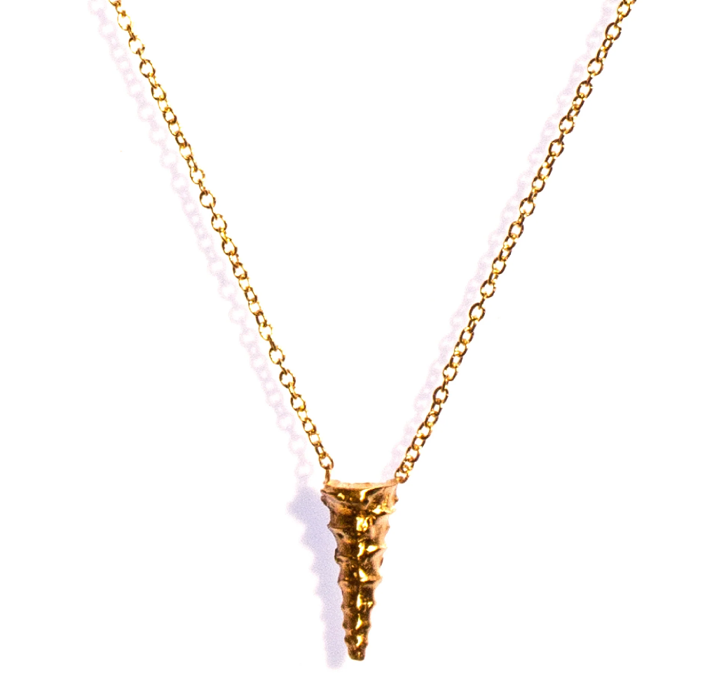 a smal gold spike pendant necklace inspired by the haworthia succulent on a white background