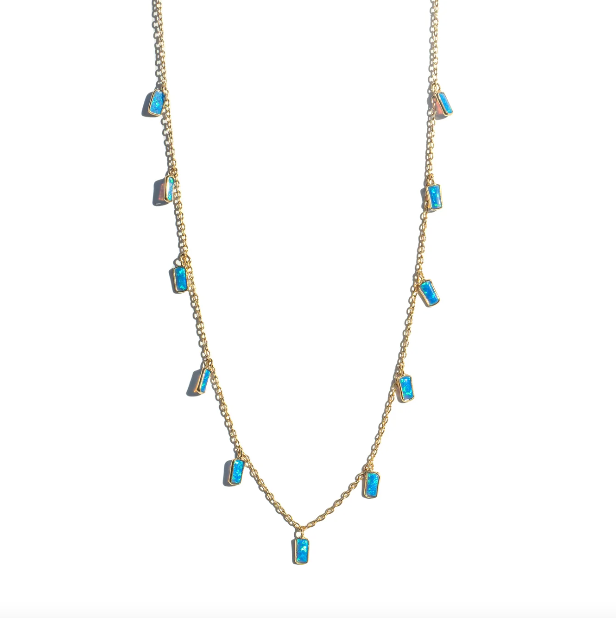 gold necklace with 11 rectangle shaped opal charms on a white background