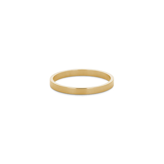 thing flat yellow gold wedding band on a white background