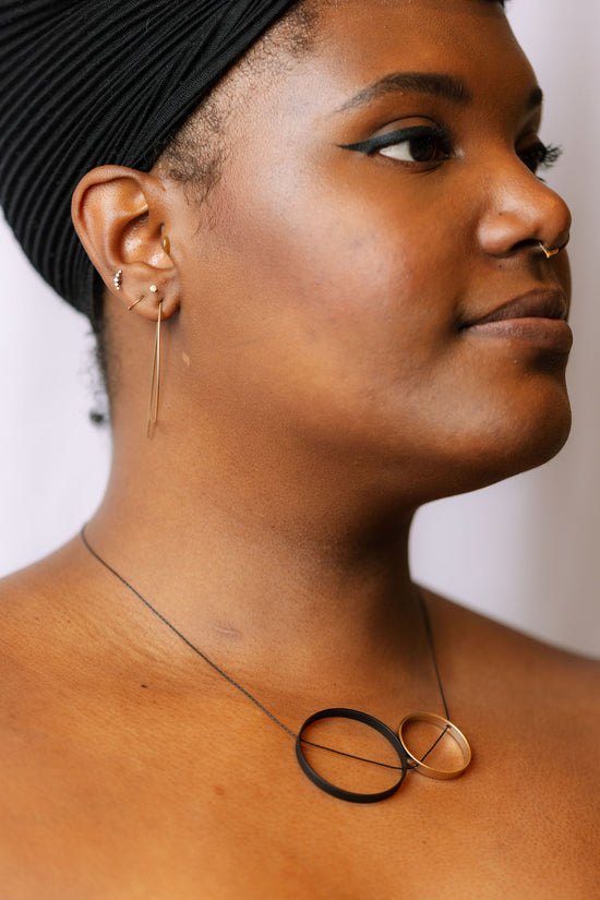 Ultra thin elipse earrings on model