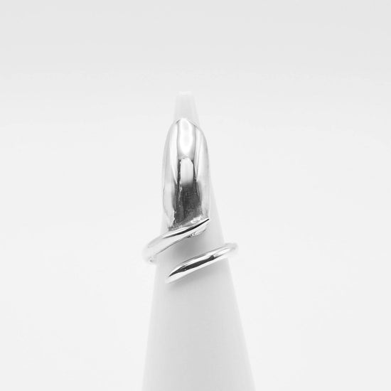 sterling silver nail ring on ring cone with white background
