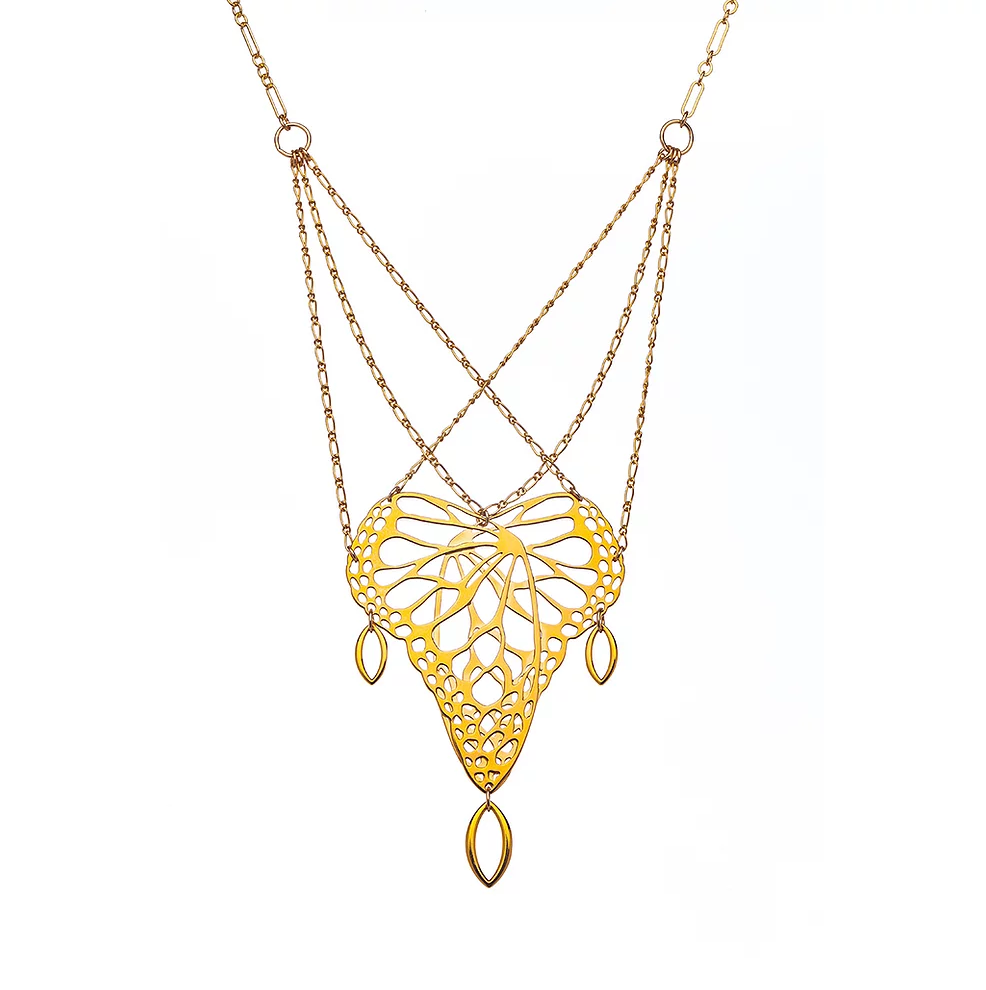 gold plated monarch butterfly inspired pendant, on overlapping chains, on a white background