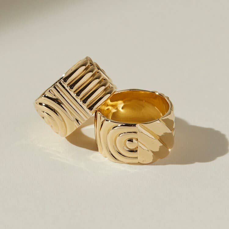 two chloe rings stacked together on a beige background