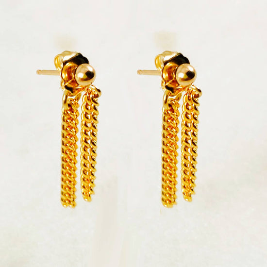 gold stud earrings with chain details on a white background