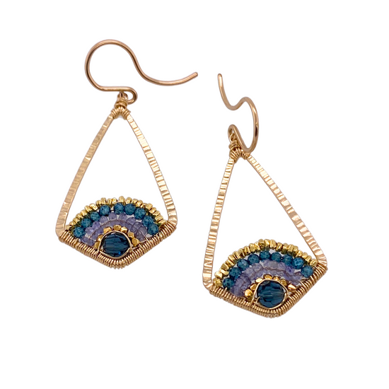 geometric drop earrings with arcs of gold and teal beads on a white background