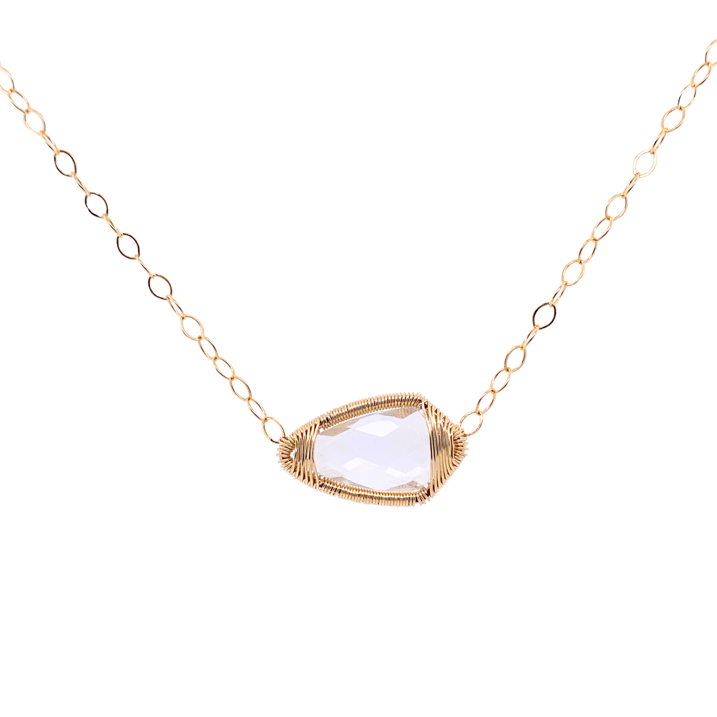 dainty gold chain necklace with a pear shaped clear crystal set east/west in a gold wire bezel 