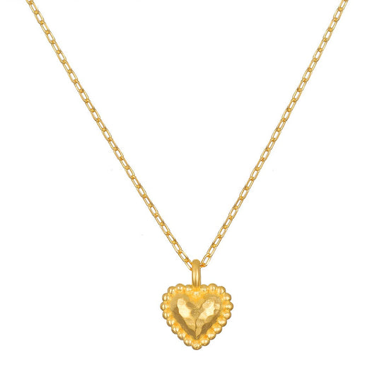 gold textured heart pendant on white background