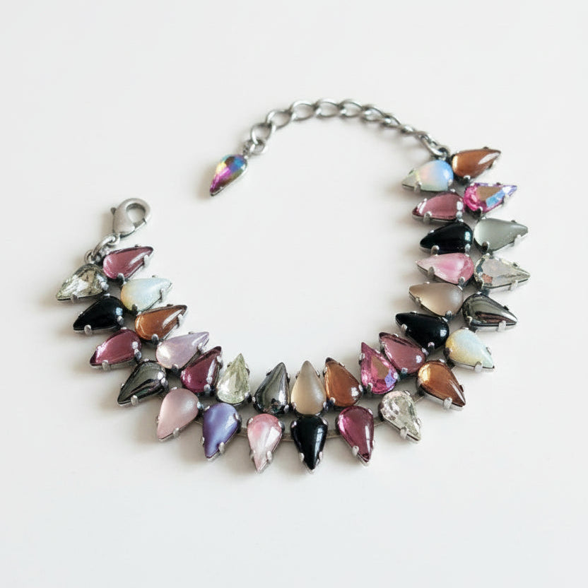 Multicolored beaded bracelet on a red surface