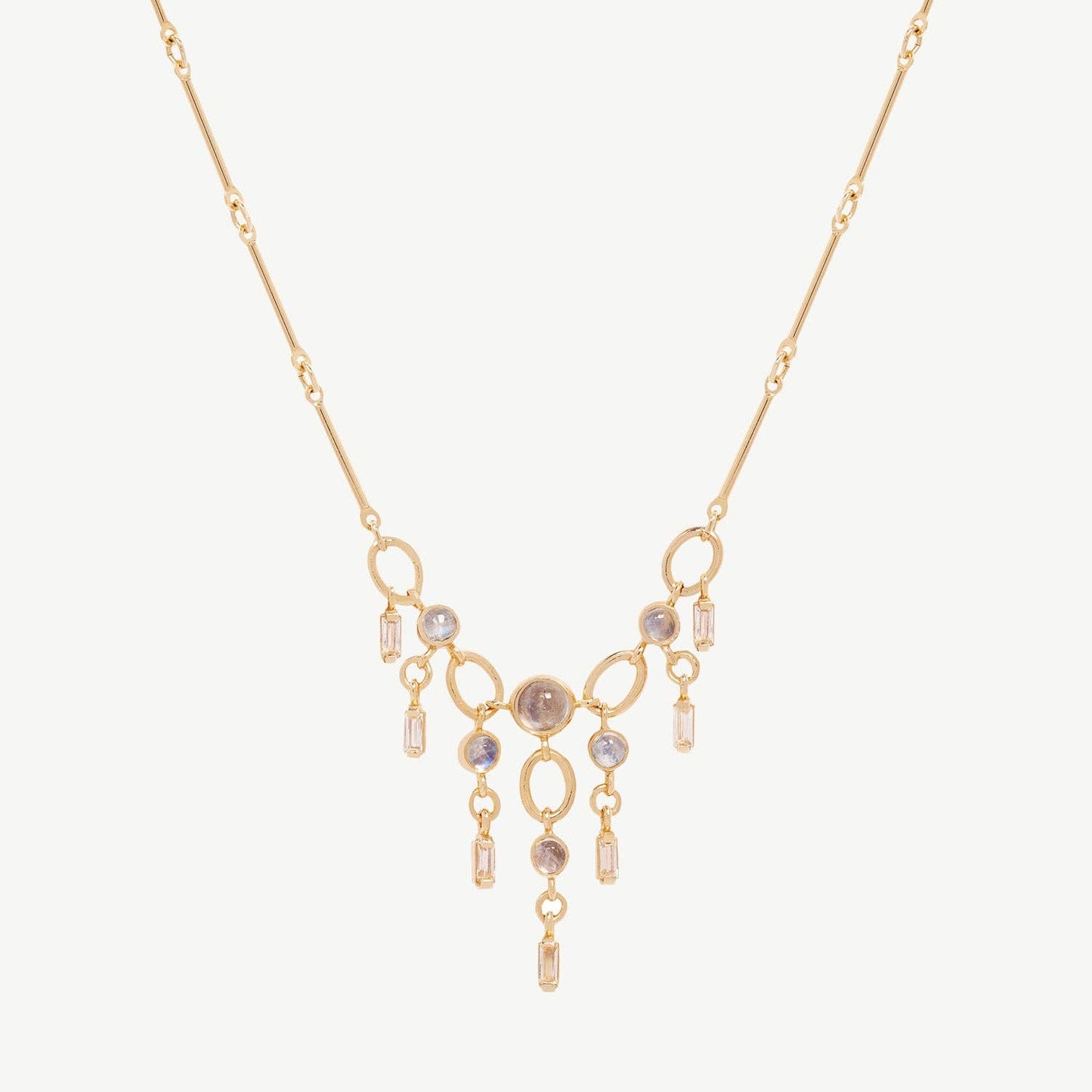 Gold necklace with gemstones on a white background