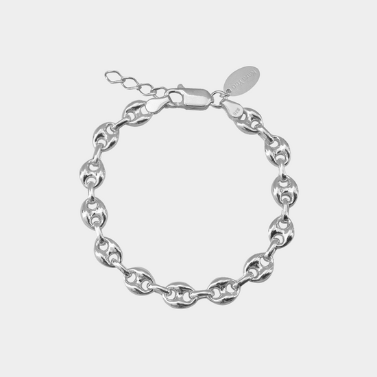 Silver chain bracelet on a white background