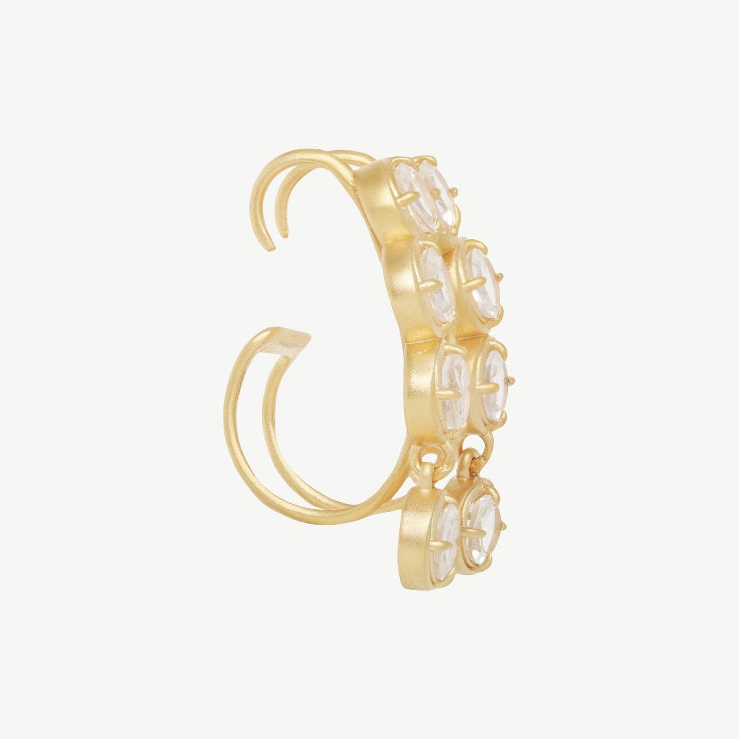 Side view of a Gold hoop earring with embedded stones on a white background