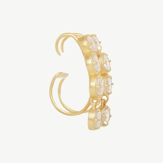 Side view of a Gold hoop earring with embedded stones on a white background