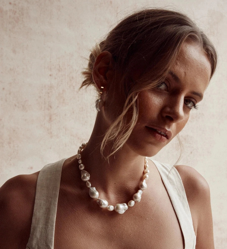 model wearing the baroque pearl necklace