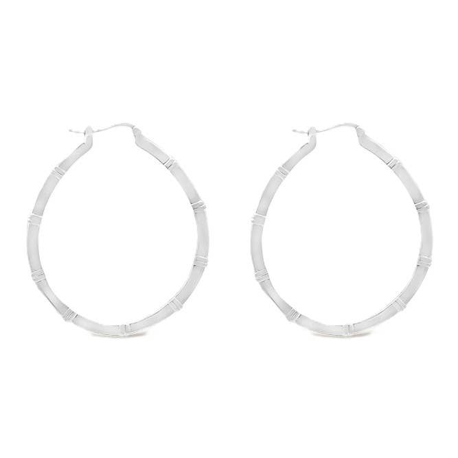 Pair of silver hoop earrings on a white background
