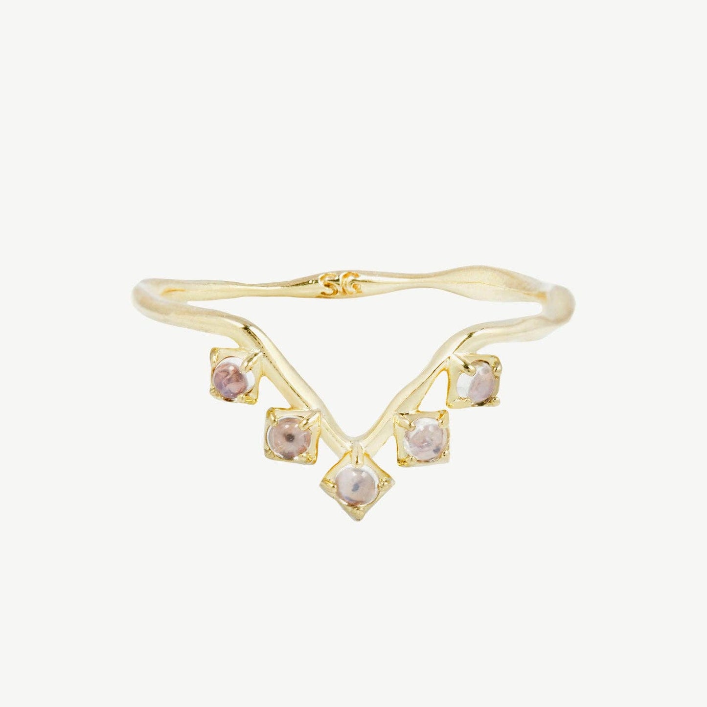 A v shaped gold band with rainbow moonstones on a white background