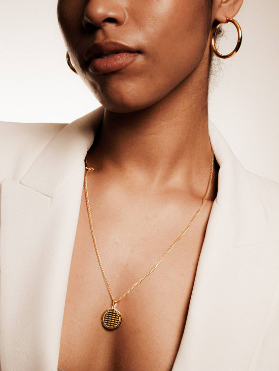 model wearing the love note necklace and gold hoops