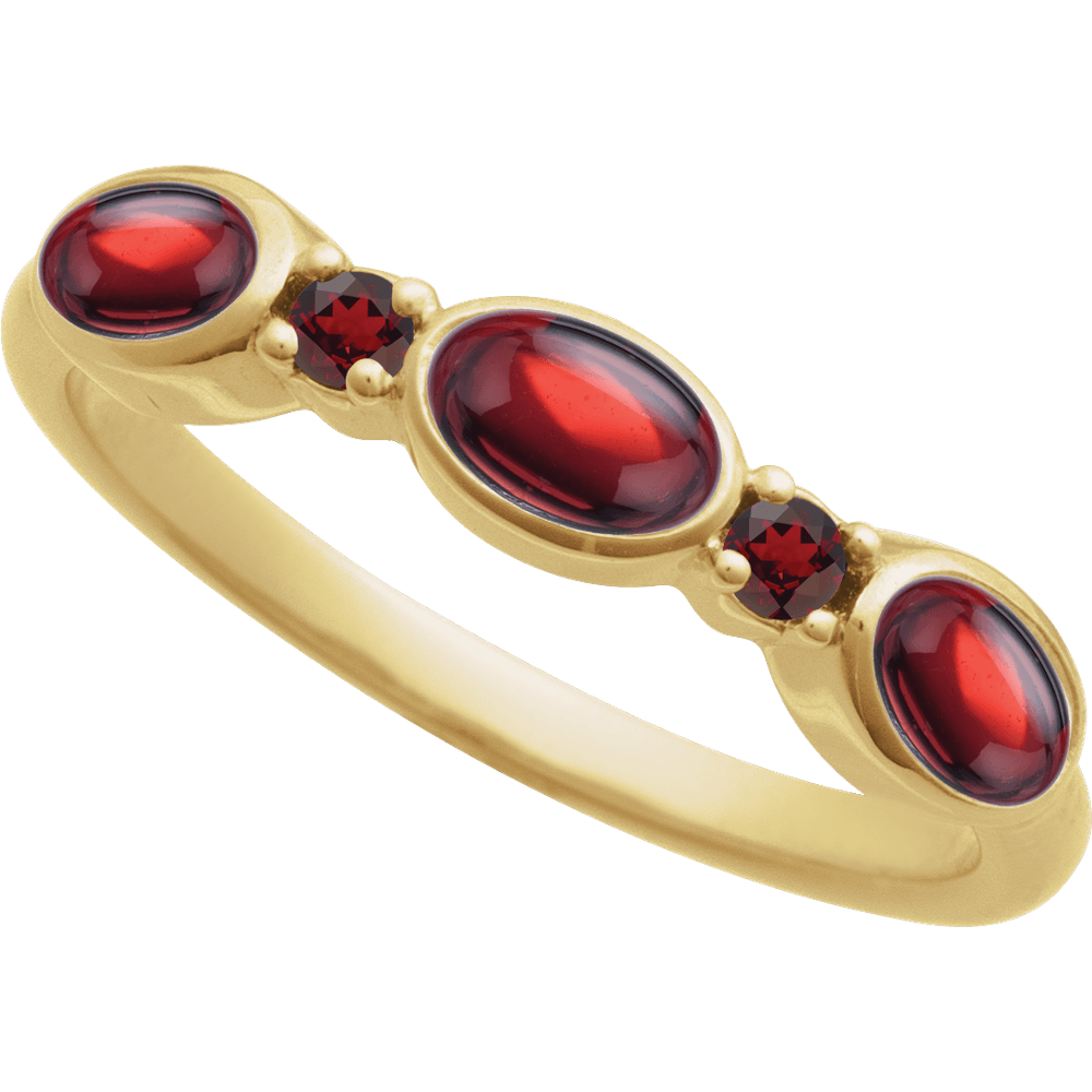Gold ring with red gemstones on a white background
