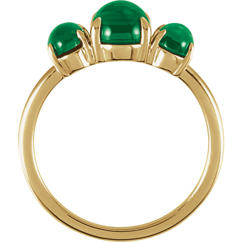 Gold ring with three green gemstones on a white background