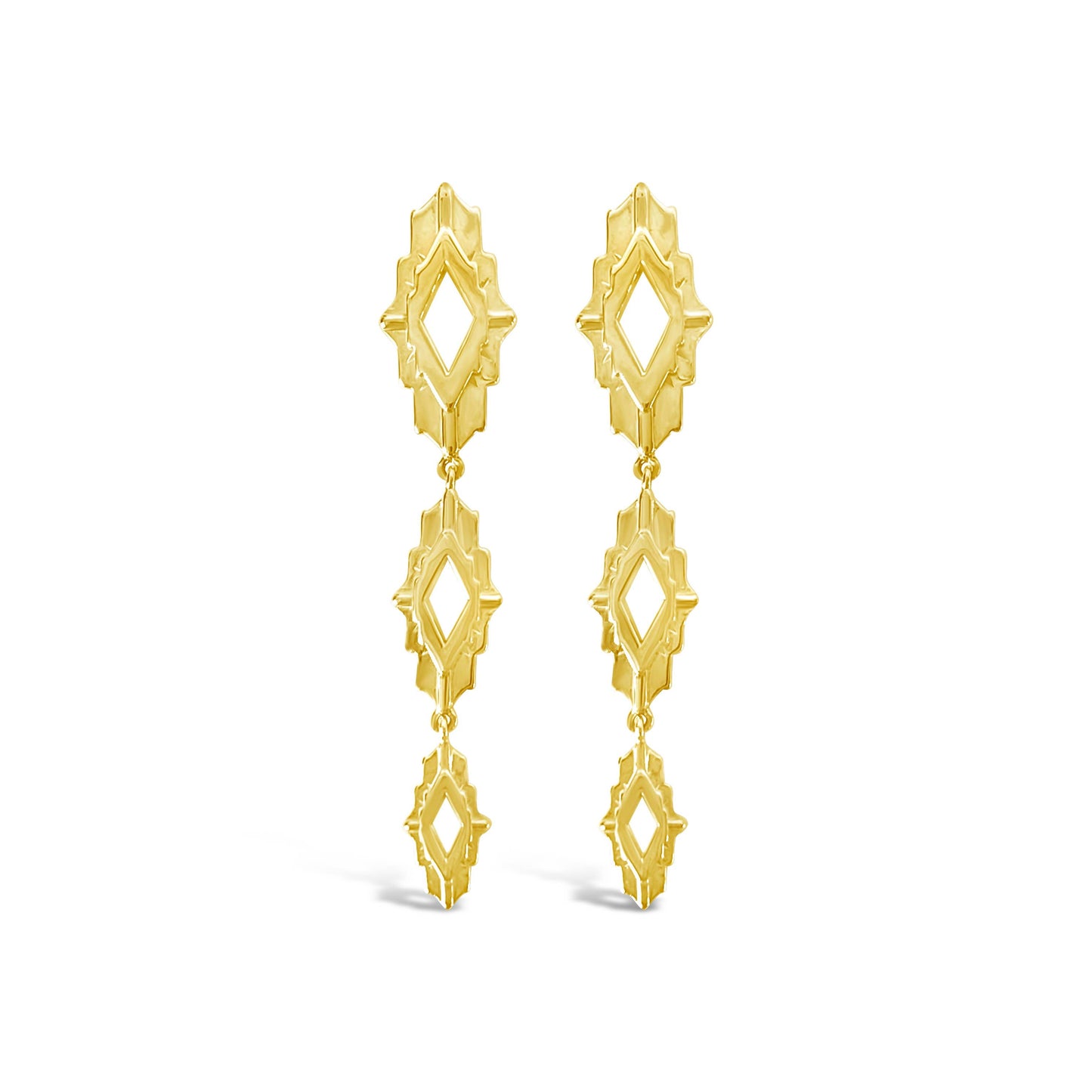 Pair of gold earrings on a white background