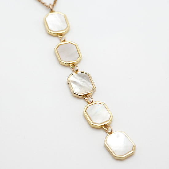 Mother of pearl drop necklace on white background