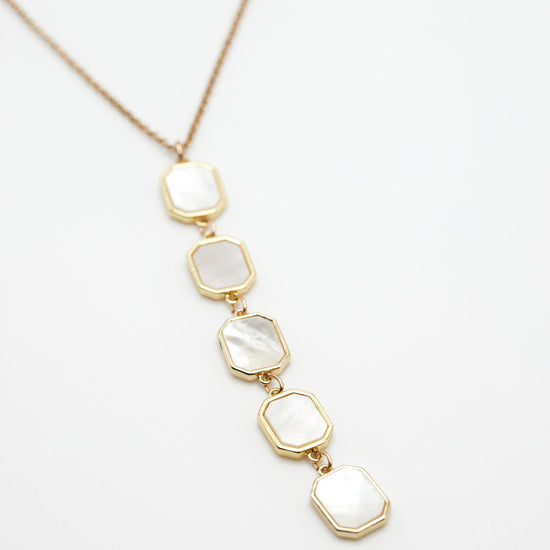 Mother of pearl drop necklace on white background