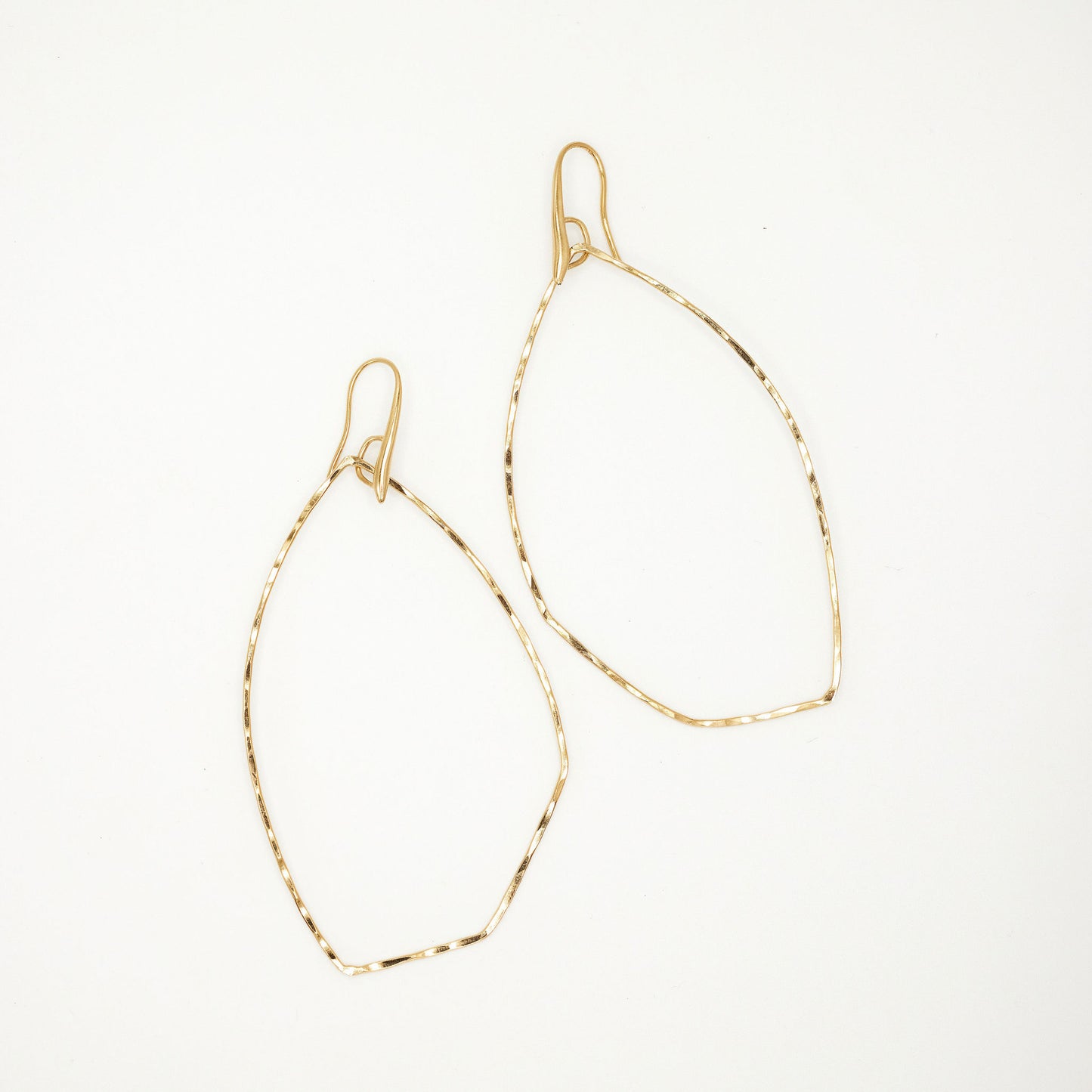 Load image into Gallery viewer, Gold hoop earrings on white background
