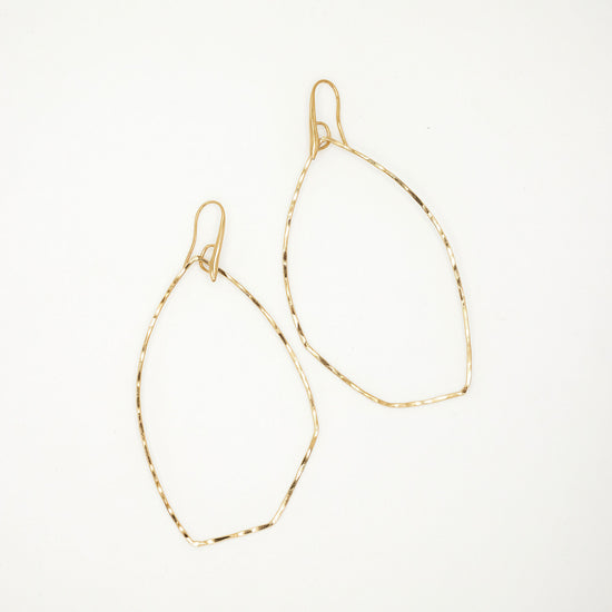 Load image into Gallery viewer, Gold hoop earrings on white background
