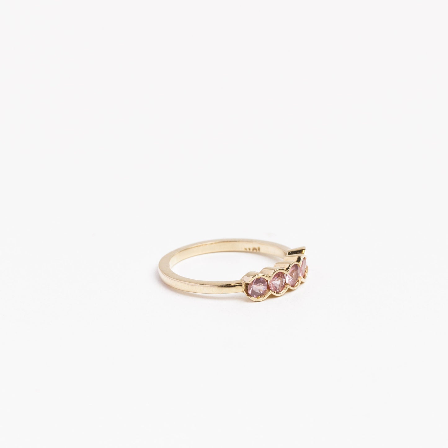 side view of the pink spinel 5 gemstone ring on a white background