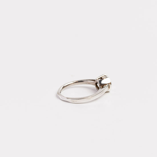 back view of the fine silver half bezel ring on a white background