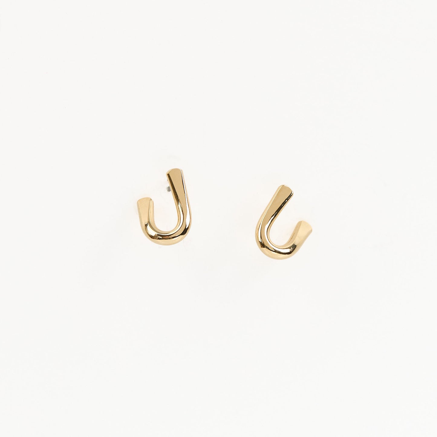 U earrings on white background