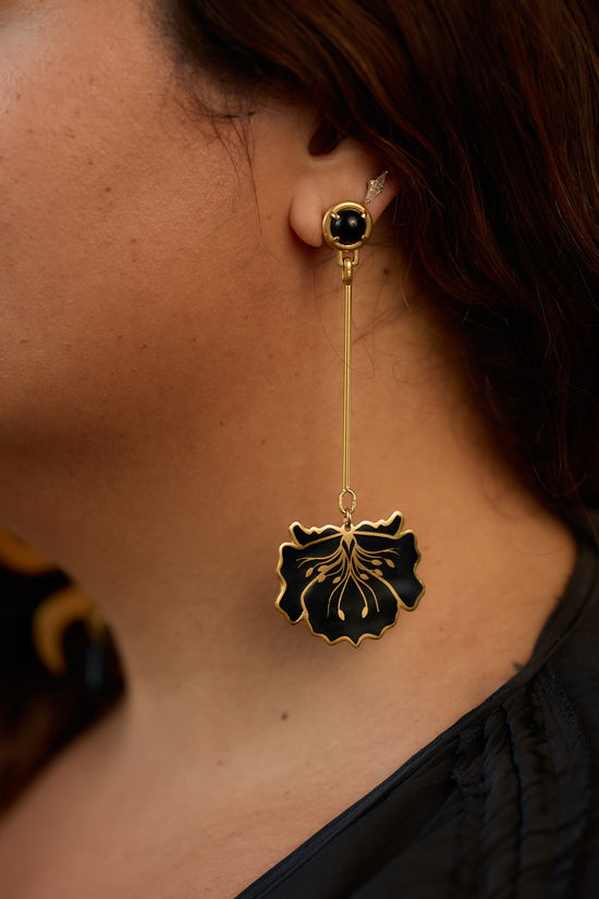 poppy statement earrings in black on model