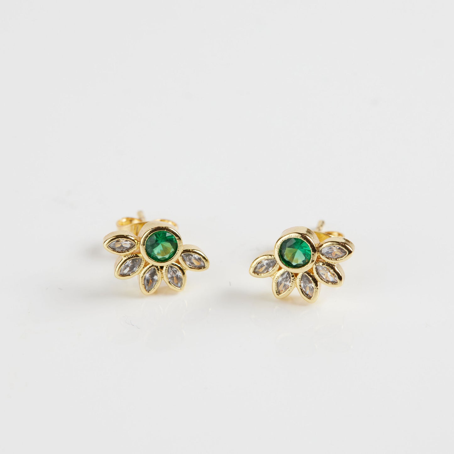 Marquise crown gemstone studs on white background
