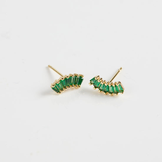 Baguette arc studs on white background