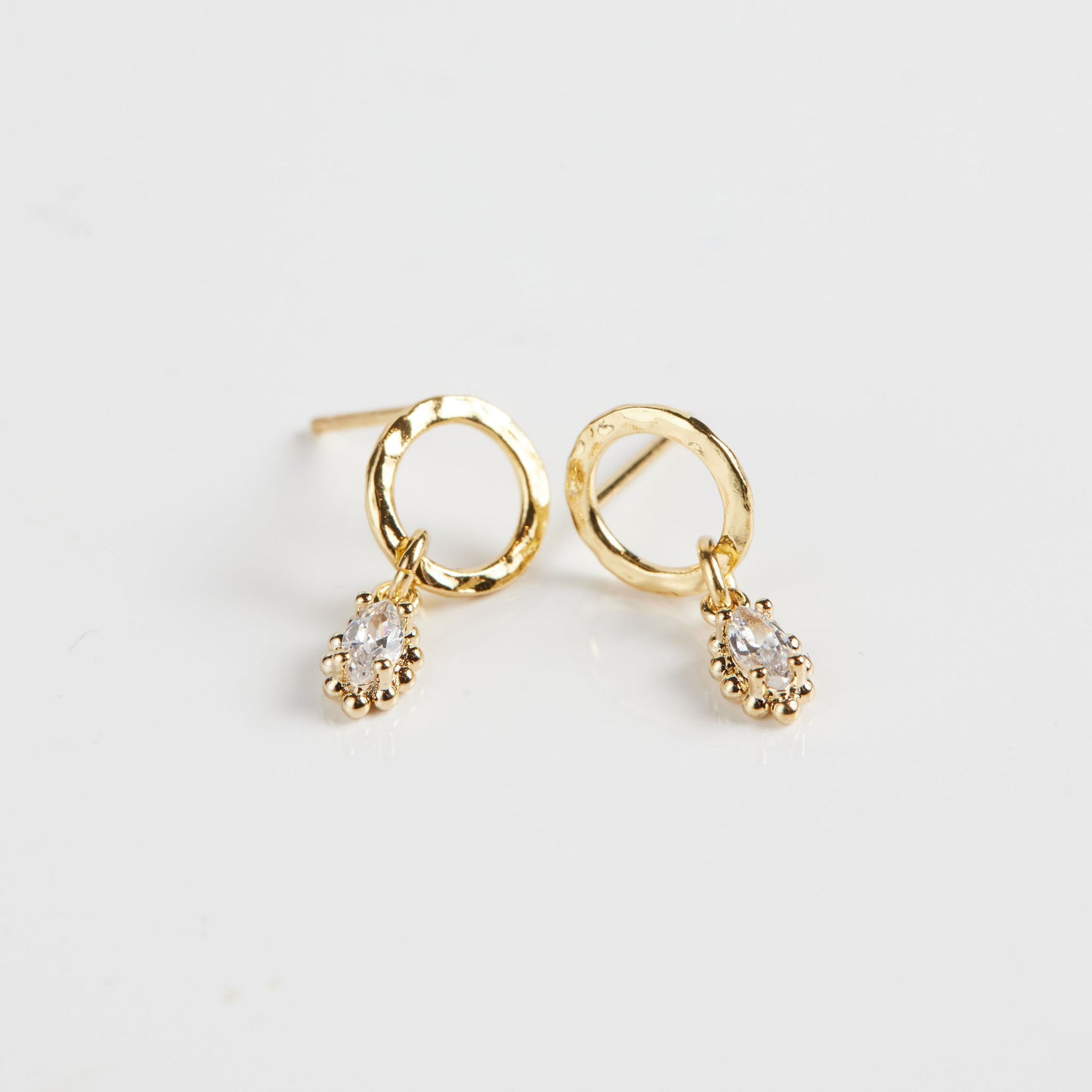 Marquise drop earrings on white background