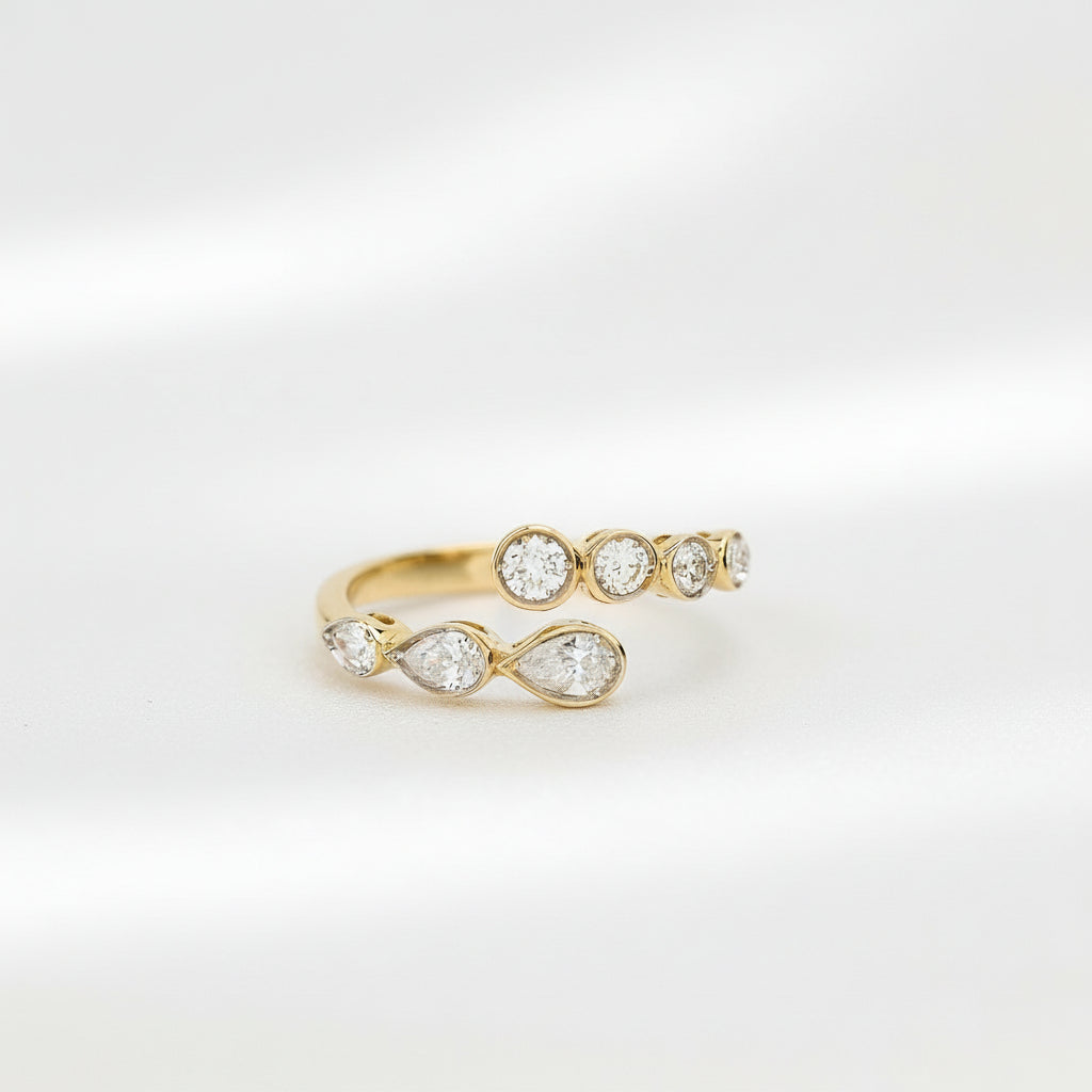 Gold ring with diamond accents on a white background