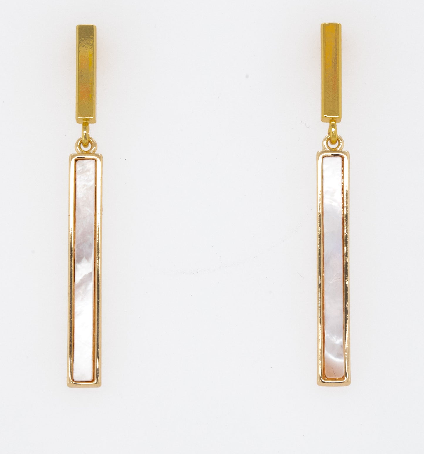 Mother of pearl bar drop studs on white background