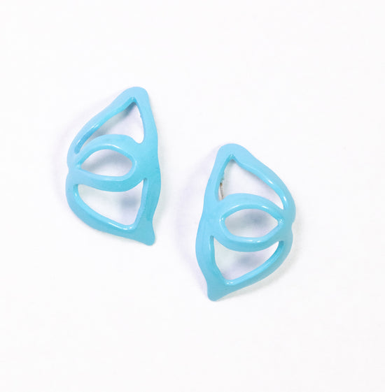 small huggie earrings on white background