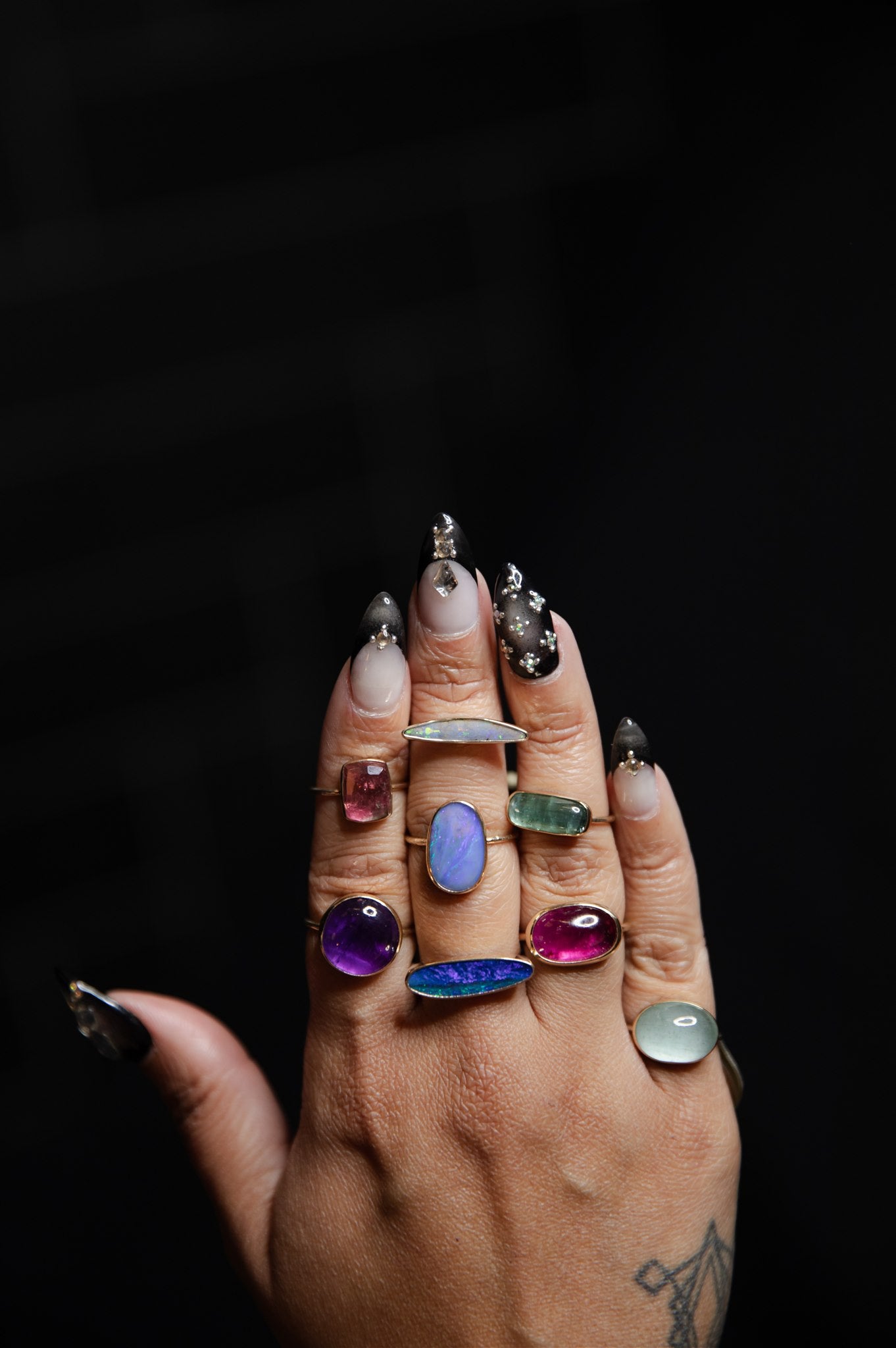 deep opal mixed metal ring on hand