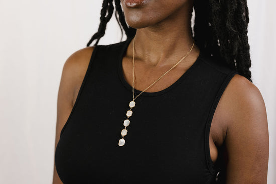 Load image into Gallery viewer, Mother of pearl drop necklace on model
