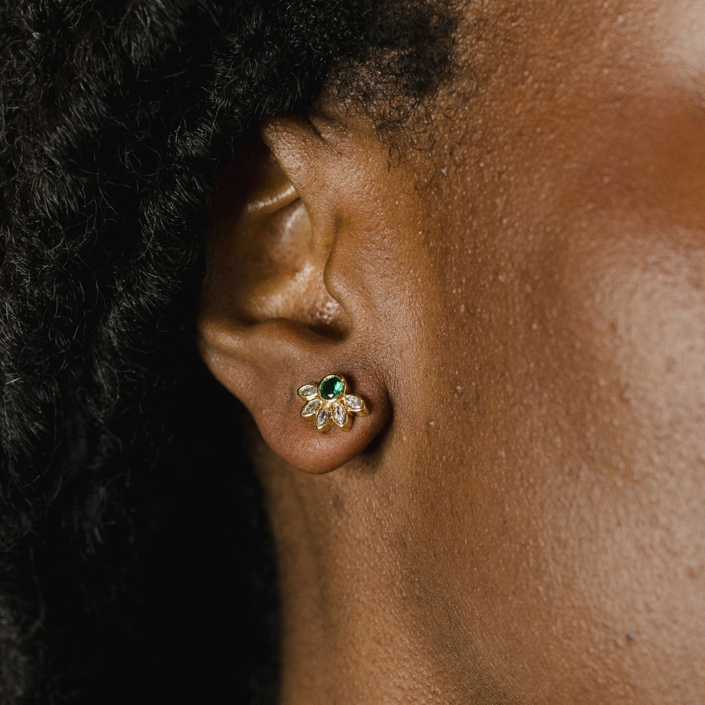 Marquise crown gemstone studs on a model