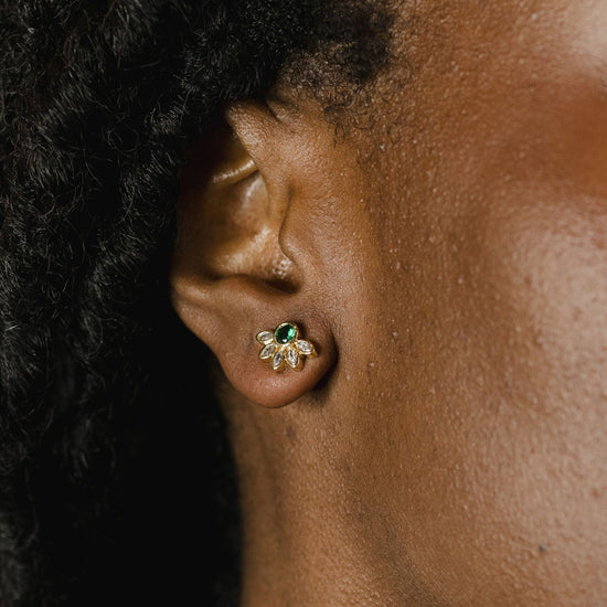 Marquise crown gemstone studs on a model