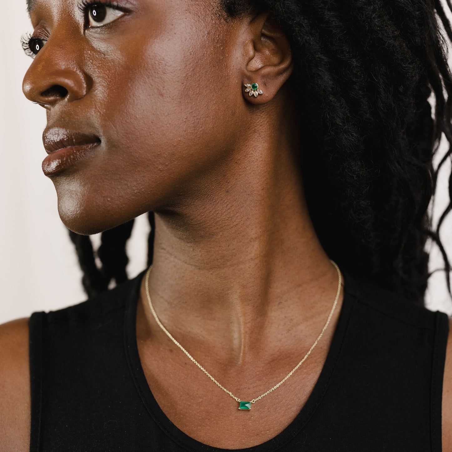 Marquise crown gemstone studs on a model