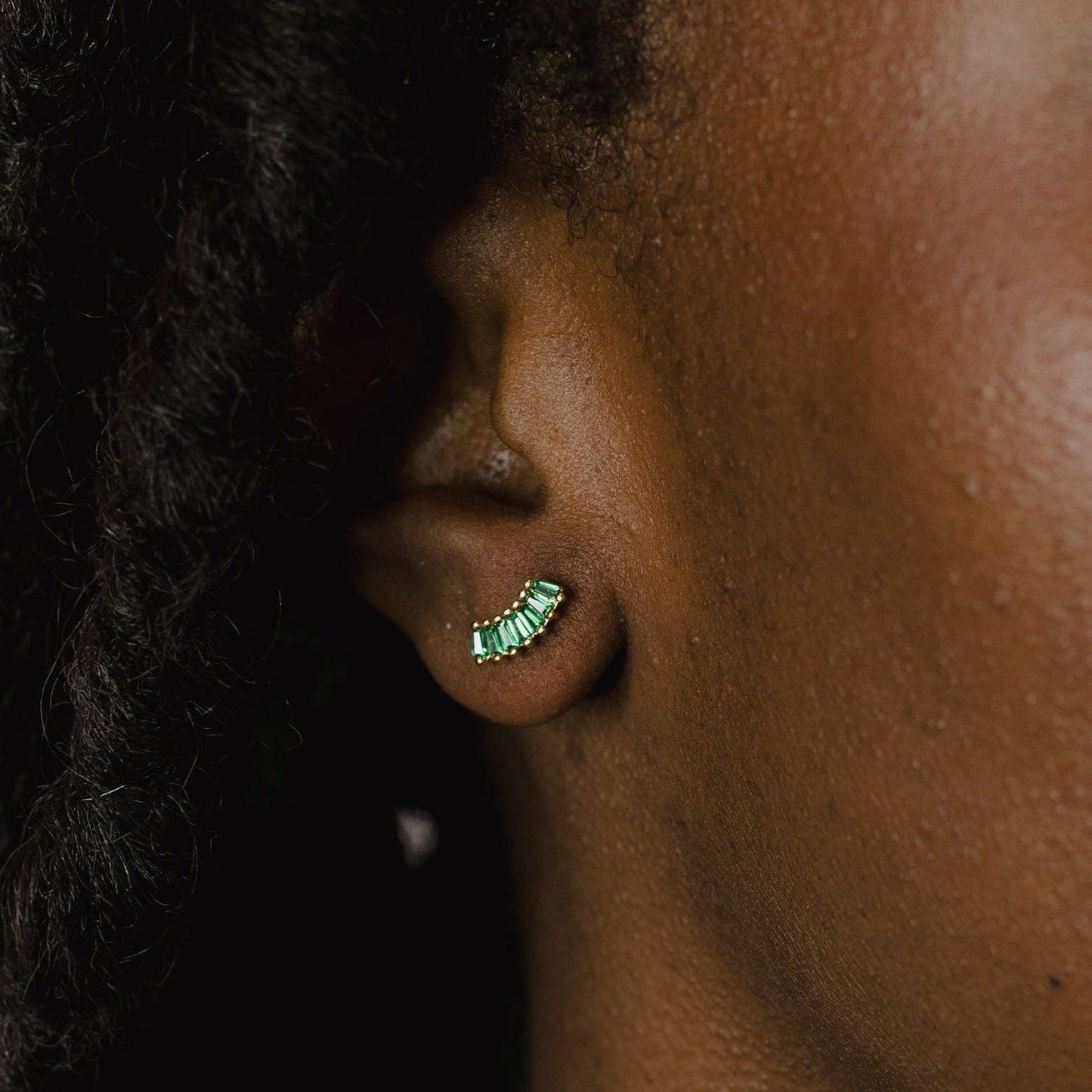 Baguette arc studs on a model